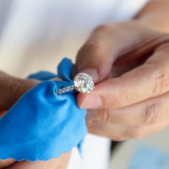 Cleaning_a_diamond_ring_with_blue_towel.jpg