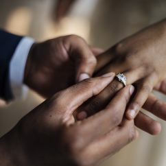 Groom_puts_ring_on_bride.jpg