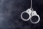 Handcuffs_hang_in_darkness.jpg