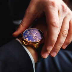 Person_wearing_a_luxury_watch_on_wrist.jpeg