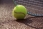 Tennis_ball_on_a_clay_court.jpg