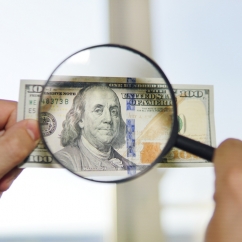 USD_bill_under_magnifying_glasses.jpg