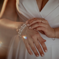 Woman_wearing_bracelet_with_rhinestones.jpg