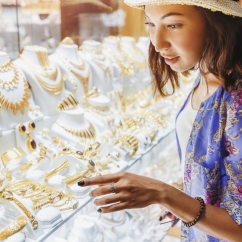 a_woman_window_shopping_and_buying_jewelry_from_a_store.jpg